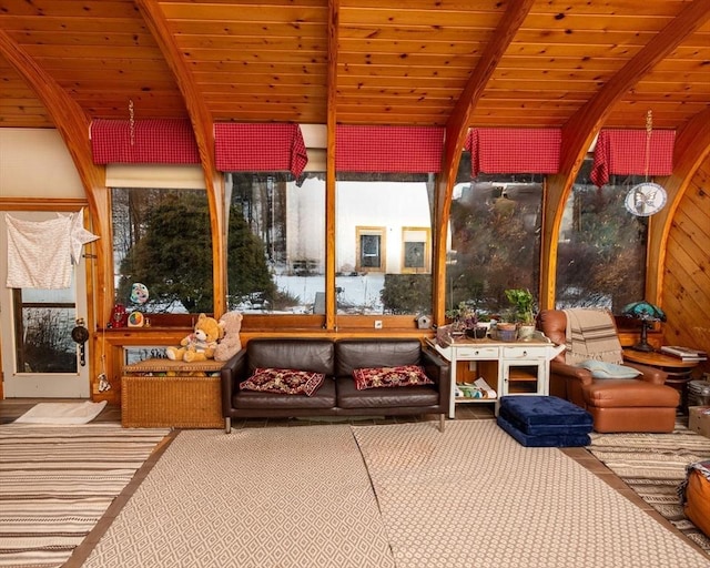 sunroom featuring wood ceiling and beam ceiling