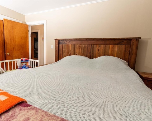 bedroom with crown molding