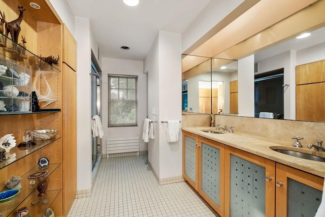 24 Aspen Ave, Newton, MA 02466 - bathroom featuring a stall shower, double vanity, tile patterned floors, and recessed lighting