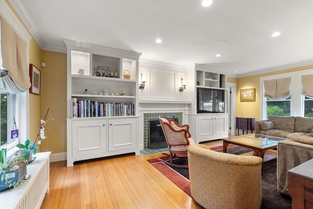 24 Aspen Ave, Newton, MA 02466 - living room featuring ornamental molding, light wood-style floors, recessed lighting, a fireplace, and radiator