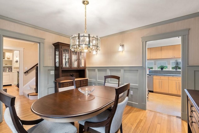 24 Aspen Ave, Newton, MA 02466 - dining room with crown molding, a chandelier, light wood finished floors, stairway, and a wainscoted wall