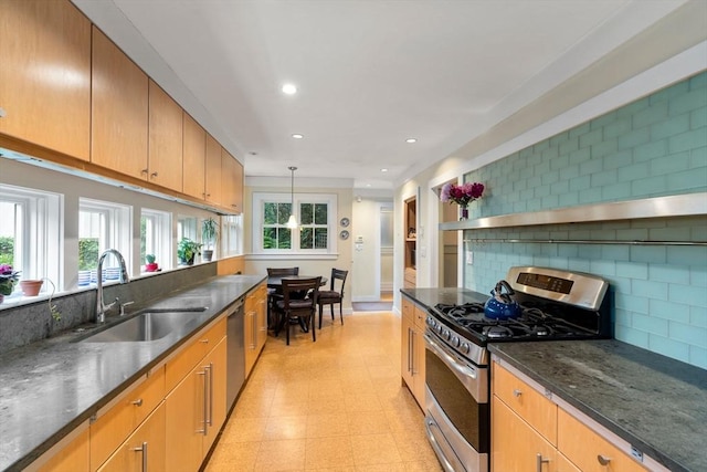 24 Aspen Ave, Newton, MA 02466 - kitchen featuring appliances with stainless steel finishes, backsplash, recessed lighting, light floors, and dark stone countertops