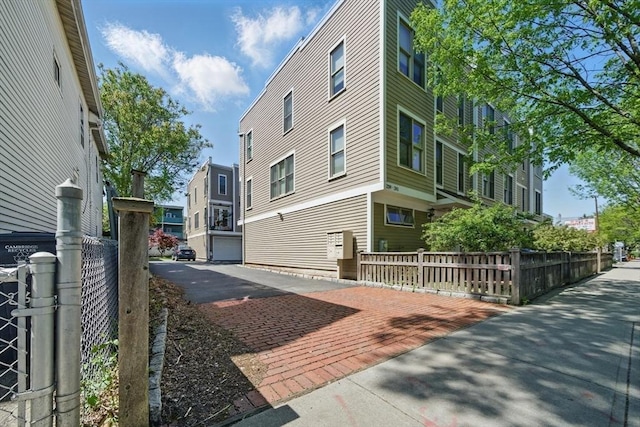 239 Prospect St Unit 2, Cambridge, MA 02139 - view of home's exterior with fence