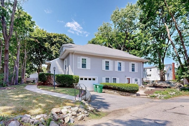 view of front of house featuring a garage and driveway