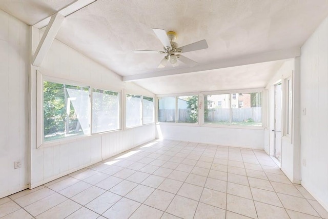 unfurnished sunroom featuring a ceiling fan, plenty of natural light, and lofted ceiling with beams