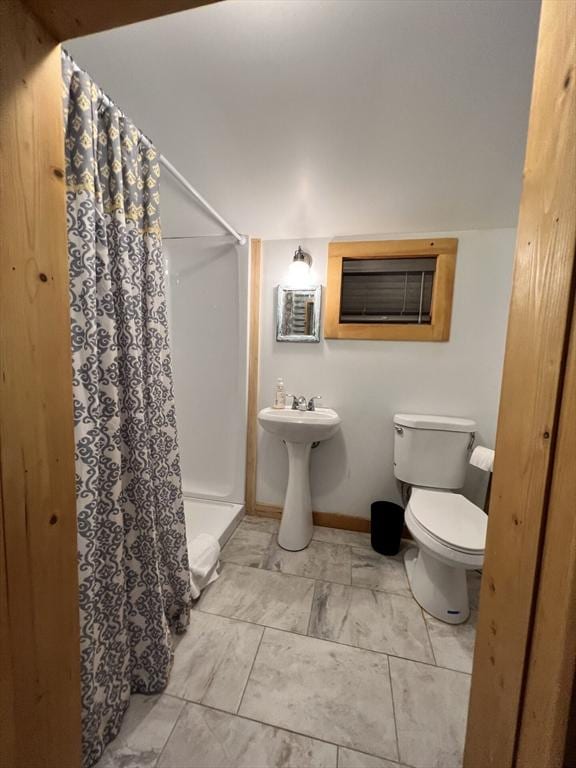 10 Kibbe Point Rd, Otis, MA 01253 - bathroom with toilet, curtained shower, baseboards, a wall unit AC, and a sink