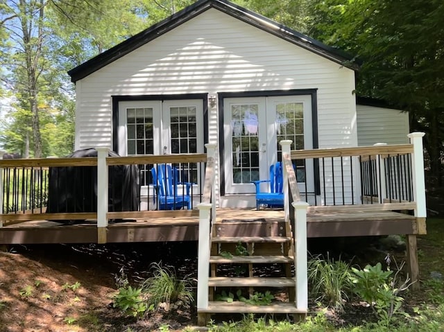 10 Kibbe Point Rd, Otis, MA 01253 - rear view of house with a wooden deck and stairs
