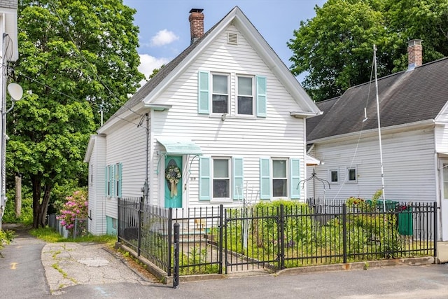119 Clark St, Clinton, MA 01510 - view of front of house with a chimney and a fenced front yard