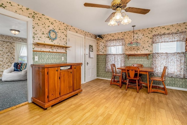 119 Clark St, Clinton, MA 01510 - dining room featuring wallpapered walls, light wood-style floors, a ceiling fan, and baseboards