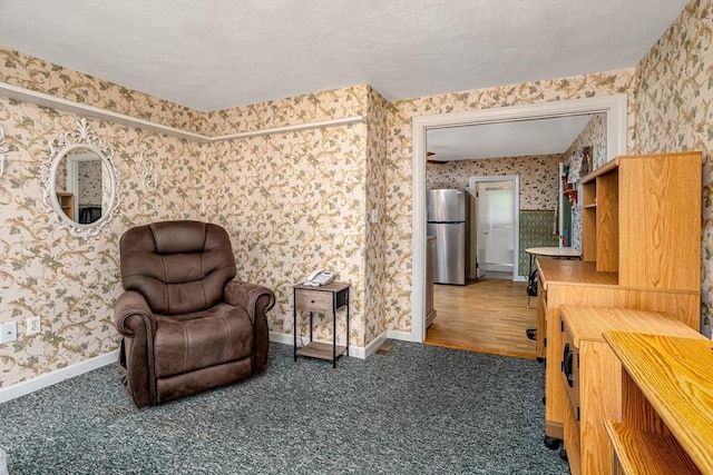 119 Clark St, Clinton, MA 01510 - living area with wallpapered walls, light colored carpet, and baseboards