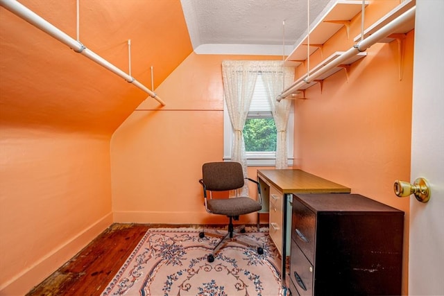 119 Clark St, Clinton, MA 01510 - office area with vaulted ceiling, wood finished floors, baseboards, and a textured ceiling