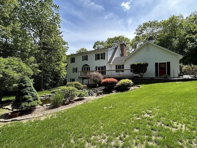 210 Wales Rd, Monson, MA 01057 - rear view of house featuring a chimney, a yard, and a deck