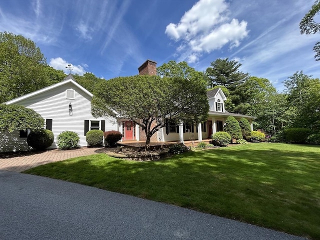 210 Wales Rd, Monson, MA 01057 - view of front of house with a front lawn, a chimney, and a porch
