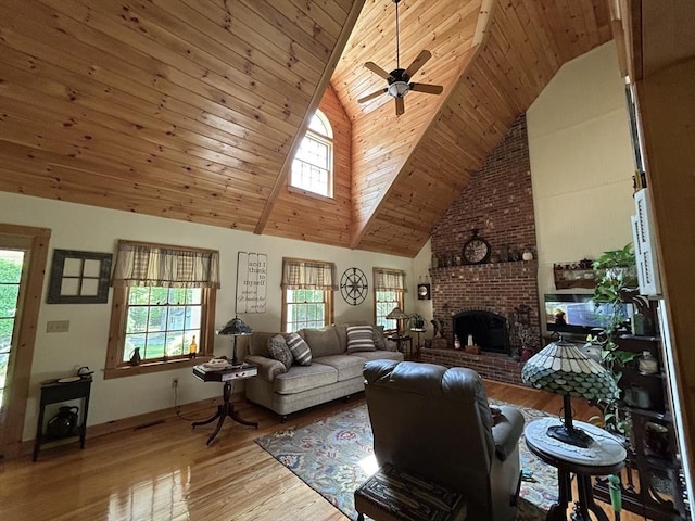 210 Wales Rd, Monson, MA 01057 - living room featuring wood finished floors, ceiling fan, wood ceiling, a brick fireplace, and high vaulted ceiling