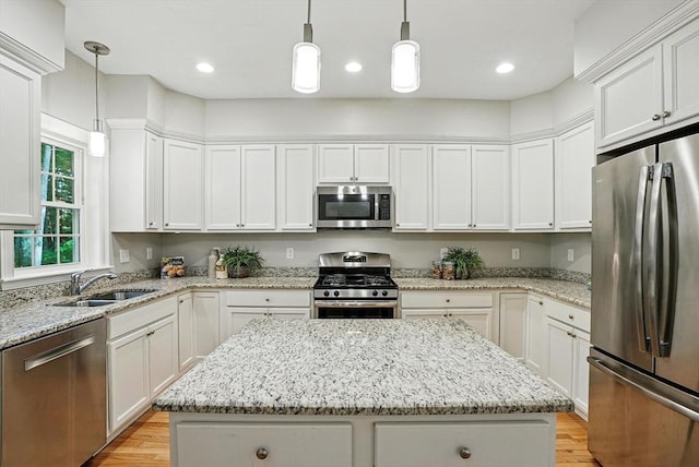 83 Partridge Hill Rd, Sutton, MA 01590 - kitchen featuring stainless steel appliances, a kitchen island, light wood finished floors, white cabinets, and recessed lighting