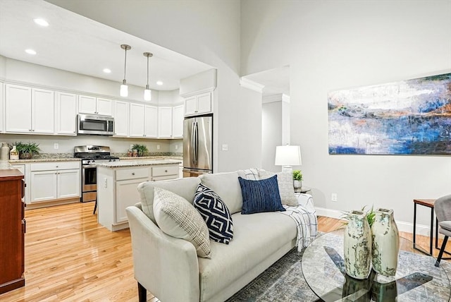 83 Partridge Hill Rd, Sutton, MA 01590 - living room featuring light wood-type flooring, recessed lighting, and a high ceiling