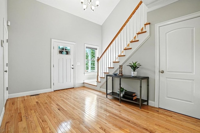 83 Partridge Hill Rd, Sutton, MA 01590 - entrance foyer featuring stairs, light wood-style floors, a chandelier, and high vaulted ceiling