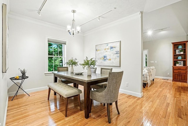 83 Partridge Hill Rd, Sutton, MA 01590 - dining area with track lighting, a chandelier, light wood finished floors, and ornamental molding