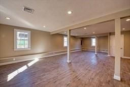 basement with hardwood / wood-style floors