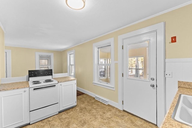 kitchen with white cabinetry, white electric range, and ornamental molding