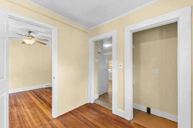 interior space with crown molding and dark hardwood / wood-style floors