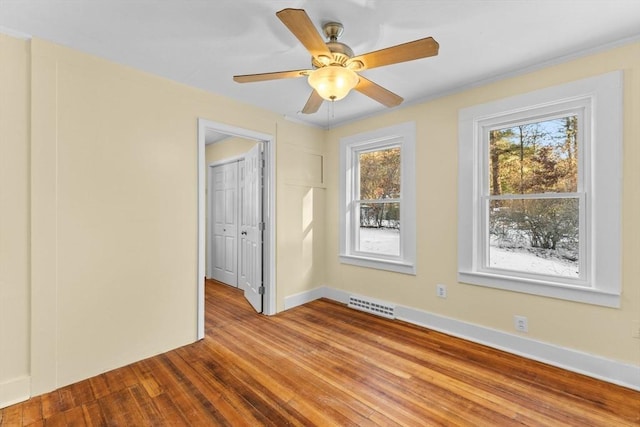 unfurnished room with ceiling fan and light hardwood / wood-style flooring