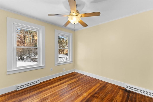 unfurnished room with wood-type flooring, ornamental molding, and ceiling fan