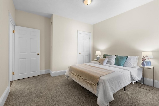 bedroom with carpet floors and baseboards