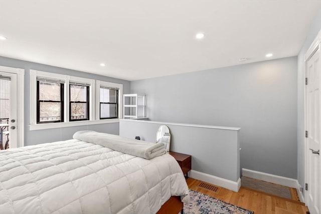120 Norway St Unit 12, Boston, MA 02115 - bedroom featuring recessed lighting, baseboards, and wood finished floors