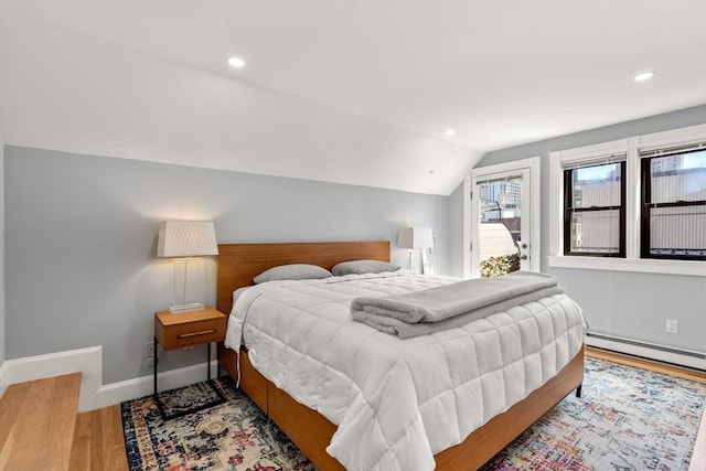 120 Norway St Unit 12, Boston, MA 02115 - bedroom with access to outside, baseboard heating, lofted ceiling, wood finished floors, and baseboards