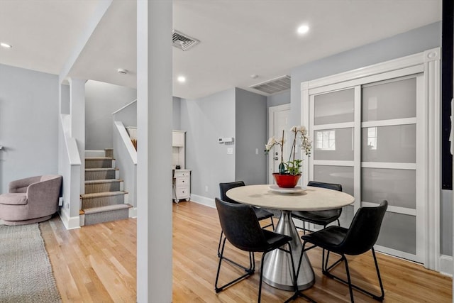 120 Norway St Unit 12, Boston, MA 02115 - dining room with stairway, light wood-type flooring, baseboards, and recessed lighting