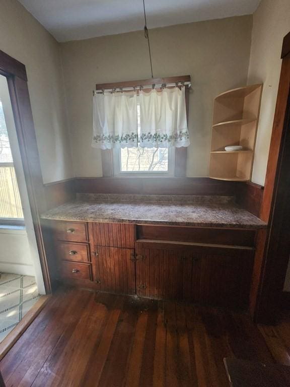 unfurnished dining area with dark hardwood / wood-style floors