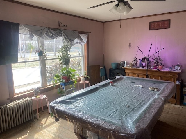 rec room with crown molding, radiator heating unit, pool table, and ceiling fan
