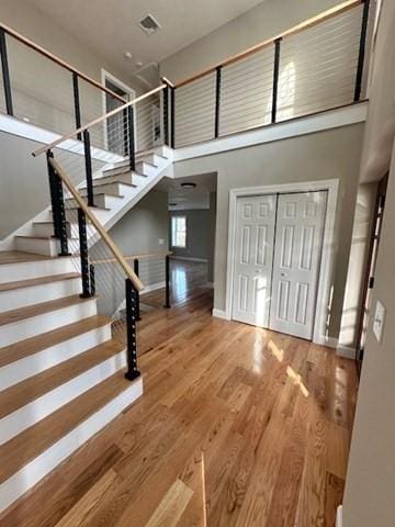 17 Mazzeo Dr, Randolph, MA 02368 - entrance foyer featuring wood finished floors, a towering ceiling, stairway, and baseboards