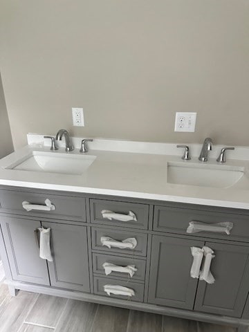 bathroom with vanity and hardwood / wood-style flooring