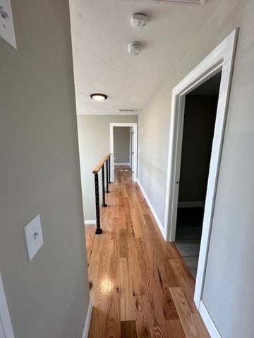 corridor featuring light hardwood / wood-style flooring