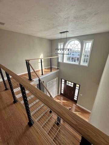 17 Mazzeo Dr, Randolph, MA 02368 - staircase with baseboards and wood finished floors