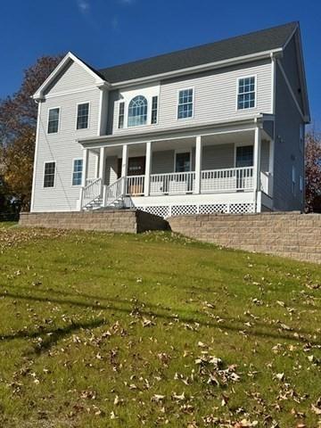 17 Mazzeo Dr, Randolph, MA 02368 - view of front of house with covered porch and a front lawn