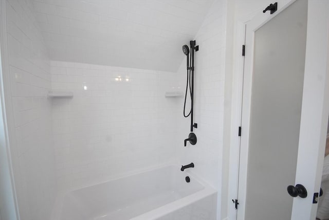 full bathroom featuring washtub / shower combination and vaulted ceiling