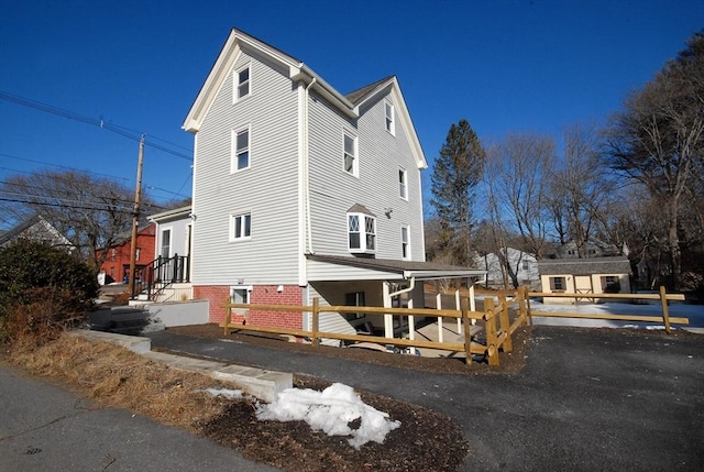 view of property exterior featuring fence