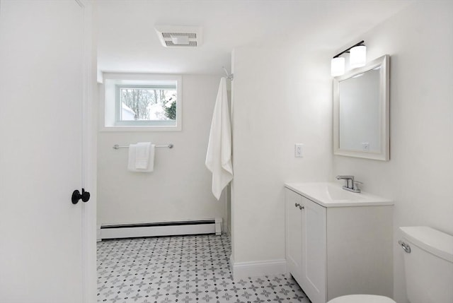 bathroom featuring a baseboard radiator, visible vents, toilet, vanity, and baseboards