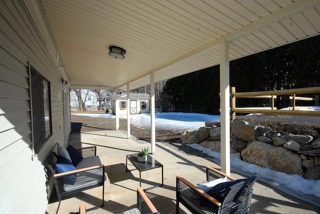 view of patio featuring an outbuilding, a shed, and outdoor lounge area