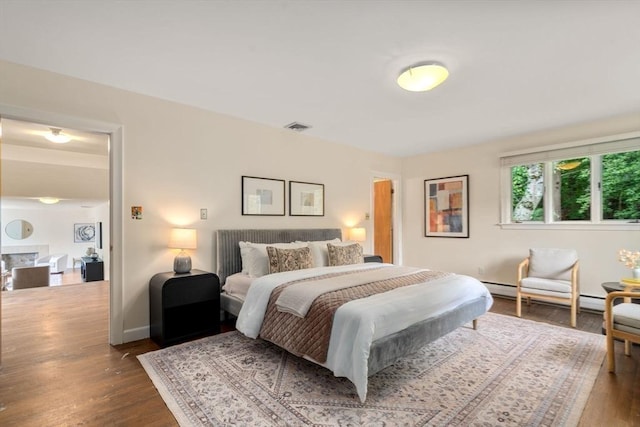 61 Sevland Rd, Newton, MA 02459 - bedroom featuring wood finished floors and baseboard heating