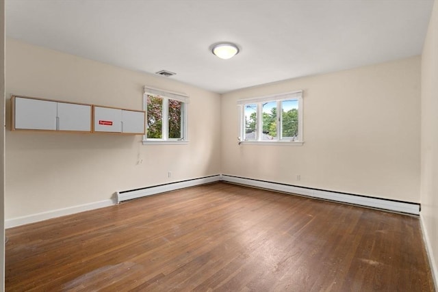 61 Sevland Rd, Newton, MA 02459 - spare room featuring wood finished floors and baseboard heating