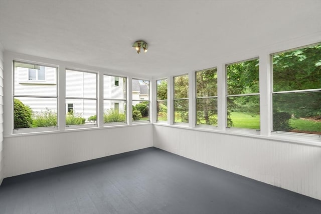 61 Sevland Rd, Newton, MA 02459 - unfurnished sunroom featuring plenty of natural light, wood walls, and wood finished floors