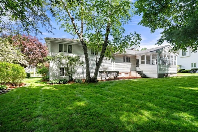 61 Sevland Rd, Newton, MA 02459 - back of house with a sunroom and a yard