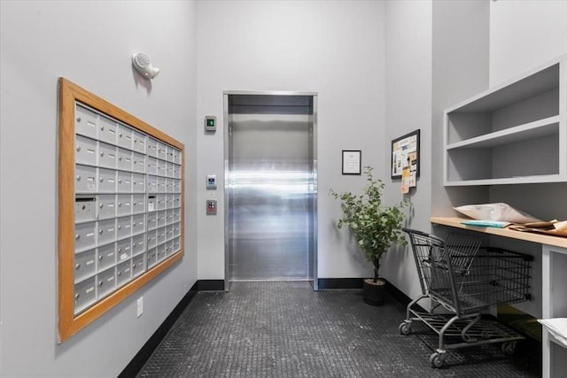 office space featuring a mail area and elevator