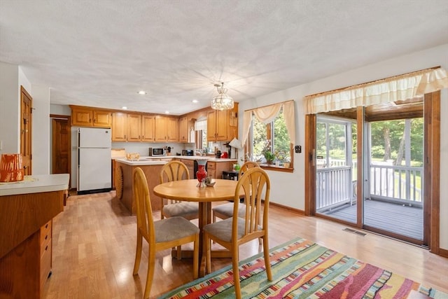 16 Parmenter Rd, Framingham, MA 01701 - dining space with light wood-type flooring and recessed lighting