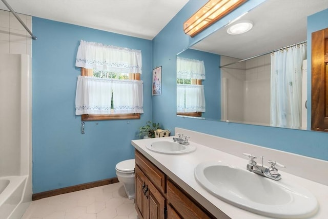 16 Parmenter Rd, Framingham, MA 01701 - bathroom featuring double vanity, tile patterned flooring, and shower / tub combo with curtain