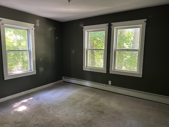 110 School St, Warren, MA 01083 - spare room featuring carpet flooring and a baseboard heating unit
